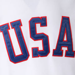 Close-up of the double-layer tackle twill embroidered USA logo on the front of a 1980 Team USA Miracle on Ice hockey jersey