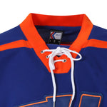 Detailed shot of the traditional white lace-up neck and collar of the hockey jersey thumbnail