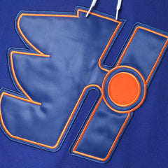 Close-up of the premium embroidered Halifax Highlanders team crest on the chest