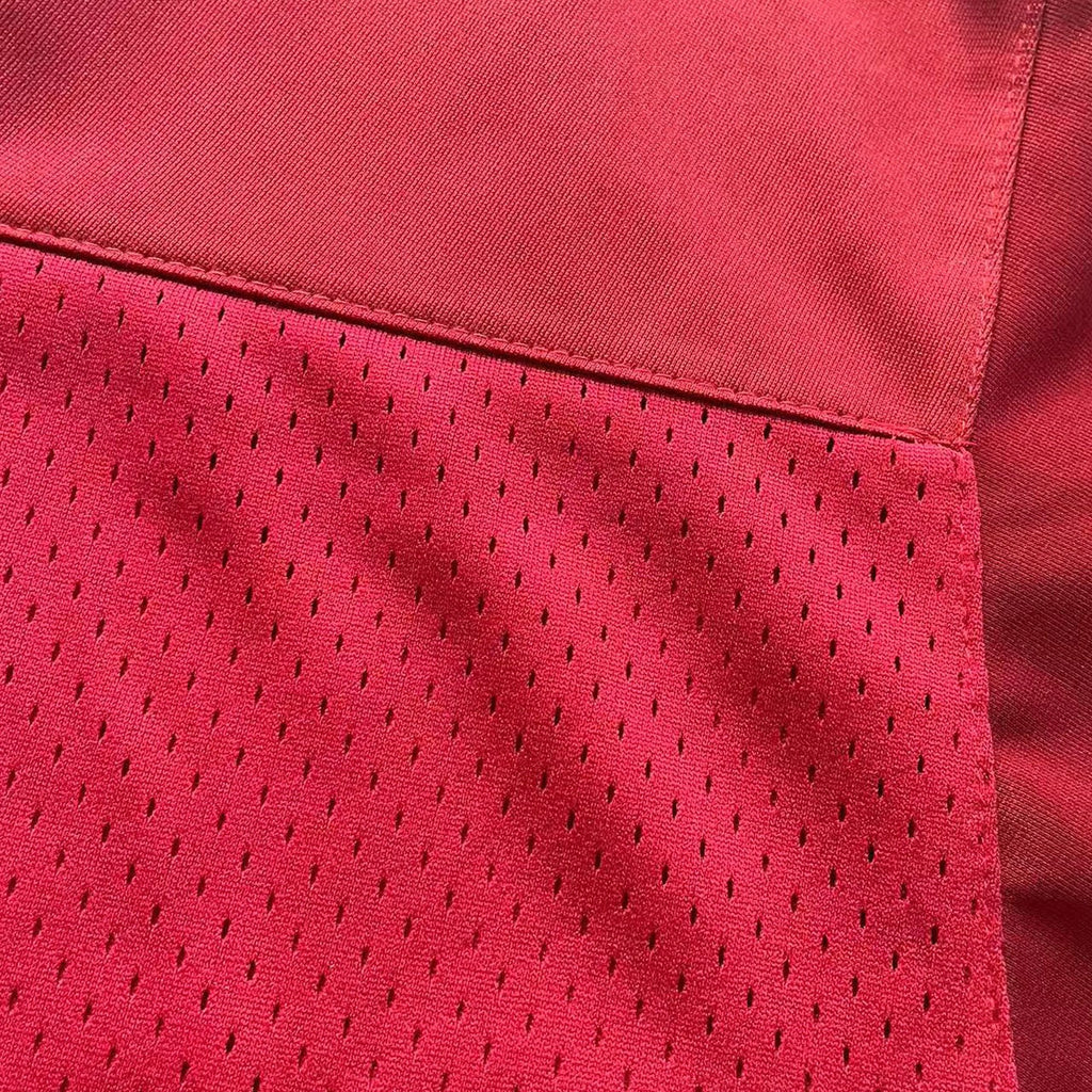 Close-up of 200 GSM heavyweight breathable mesh fabric used for movie replica jerseys.