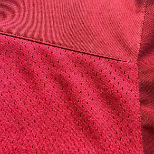 Close-up of 200 GSM heavyweight breathable mesh fabric used for movie replica jerseys.