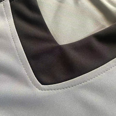 Detailed view of the rib-knit collar and neck stitching on the Peanuts Wildcats football jersey #20