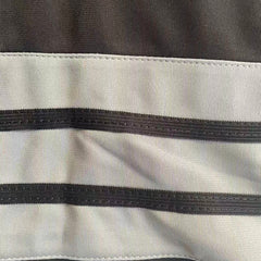 Magnified view of the classic striped knit ribbing on the sleeve of the Peanuts Wildcats football jersey