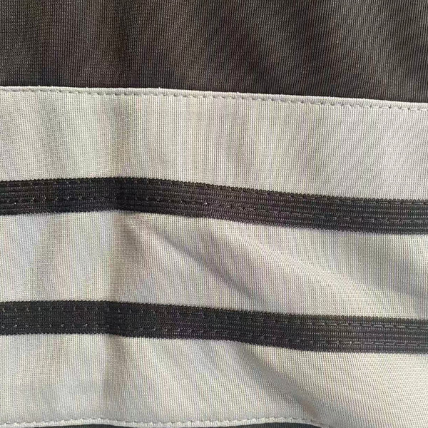 Magnified view of the classic striped knit ribbing on the sleeve of the Peanuts Wildcats football jersey