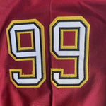 Detailed stitching of number 99 on the sleeve of Steve Lattimer football jersey. thumbnail