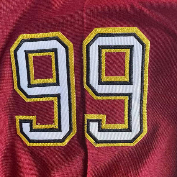 Detailed stitching of number 99 on the sleeve of Steve Lattimer football jersey.